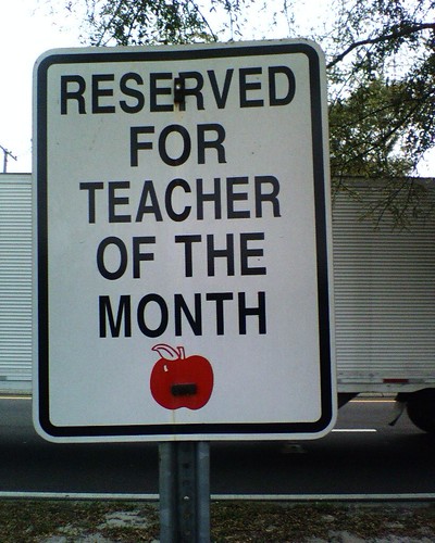 sign reading "reserved for teacher of the month"